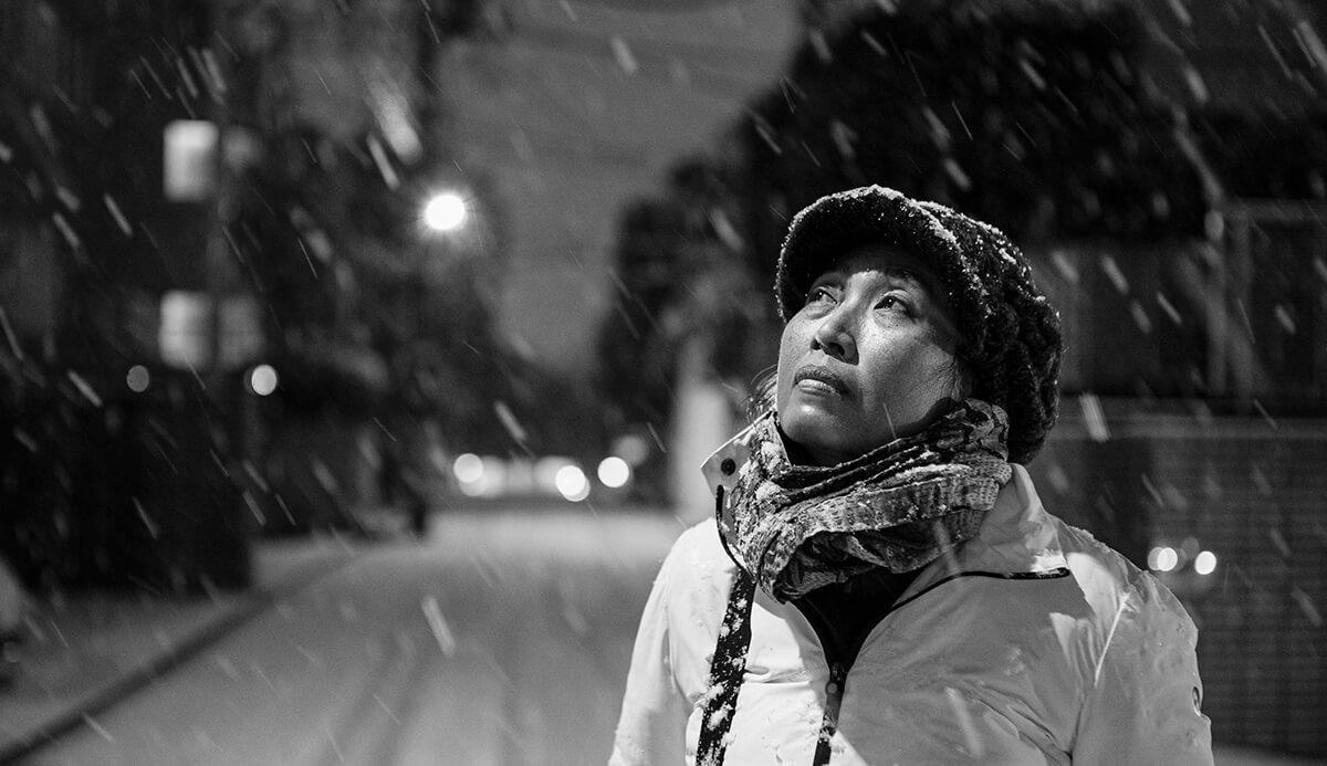 Portrait of a women in the snow in Japan. Photo by Yvan Cohen from LightRocket. Shot with 50mm lens.