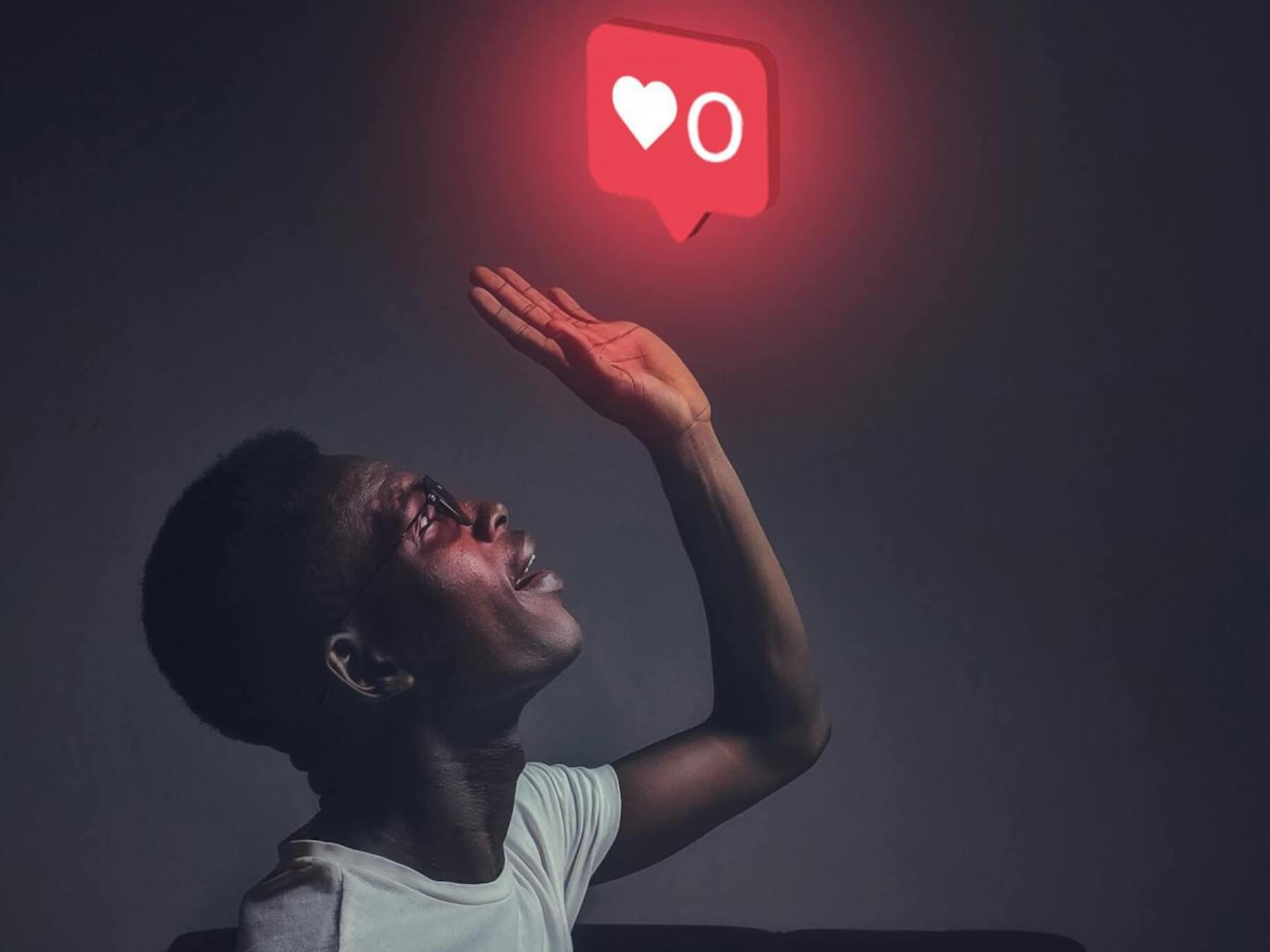 Man reaching for a social media like