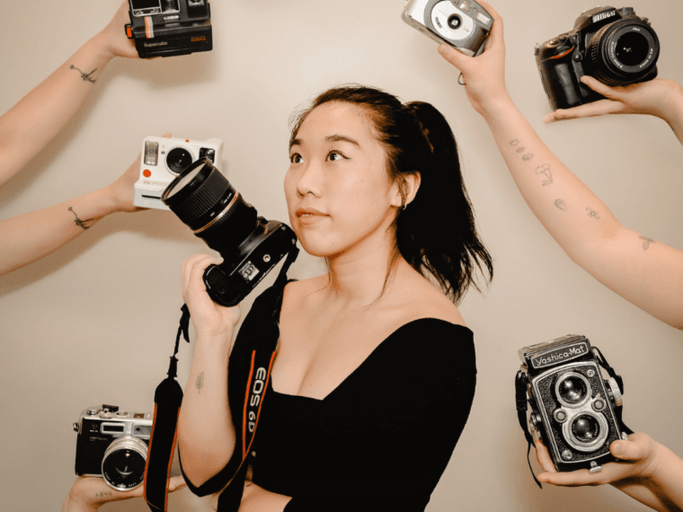 Woman holding a camera.