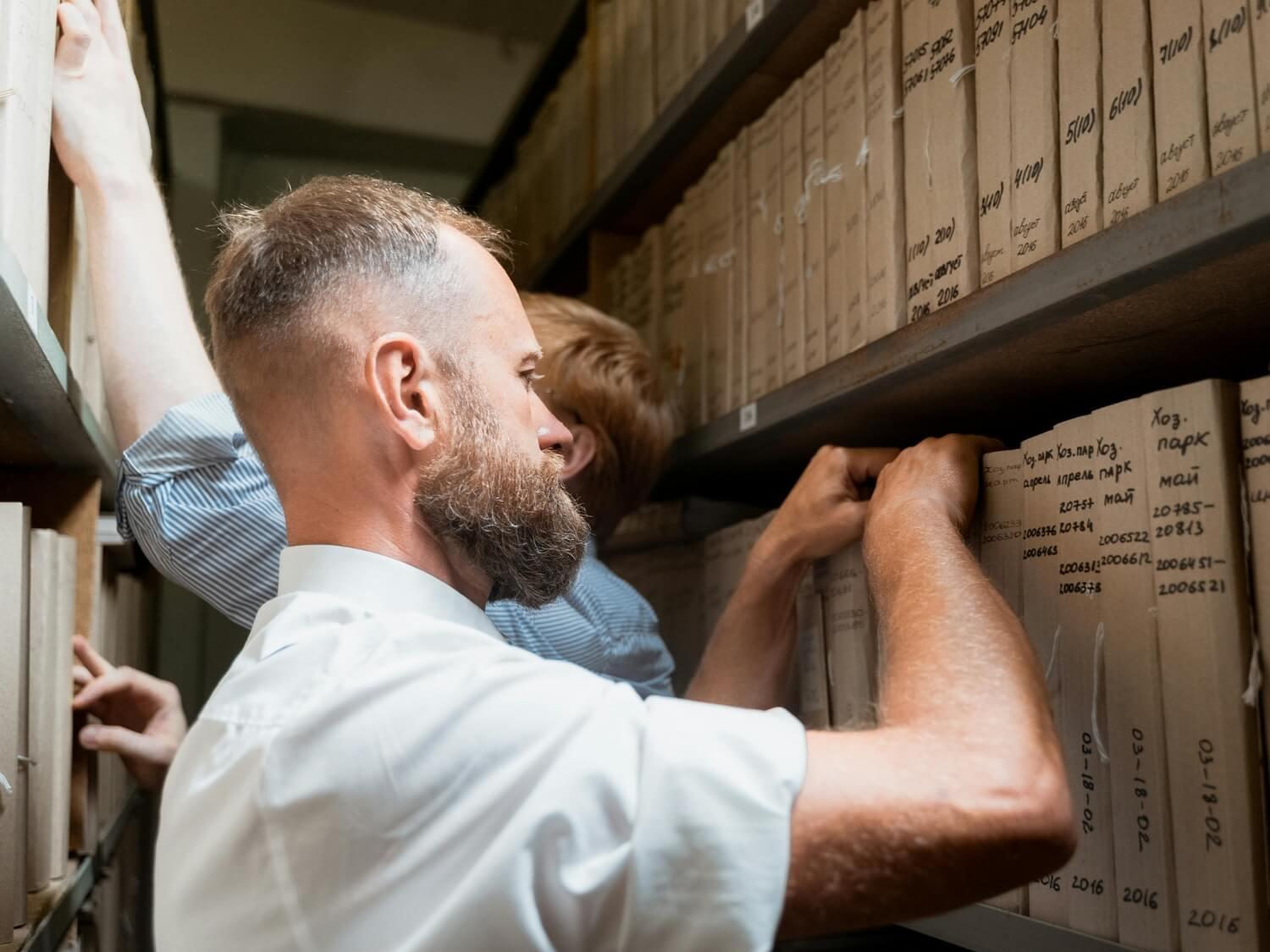 Men working in a file archive.