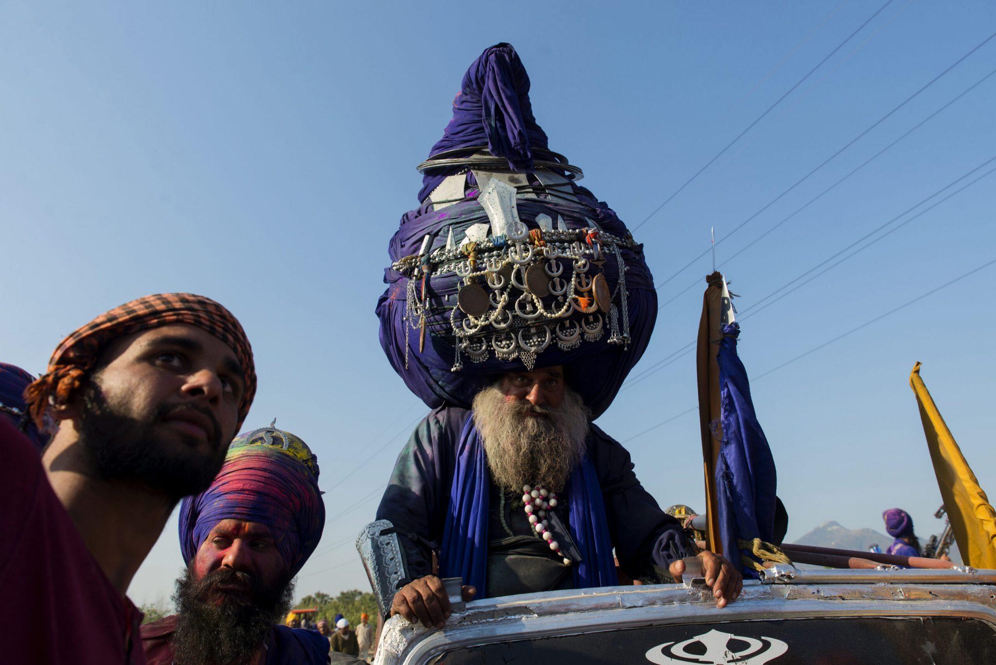 A Nihang Sikh with a huge turban arrives at the ground where martial skills are displayed during Hola Mohalla festival. Photo and story credits by Subhendu Sarkar