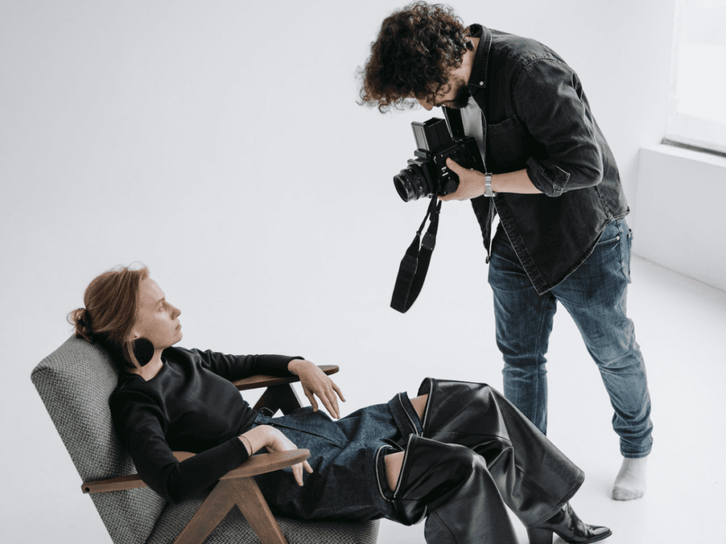 Photographing a model sitting in a chair.