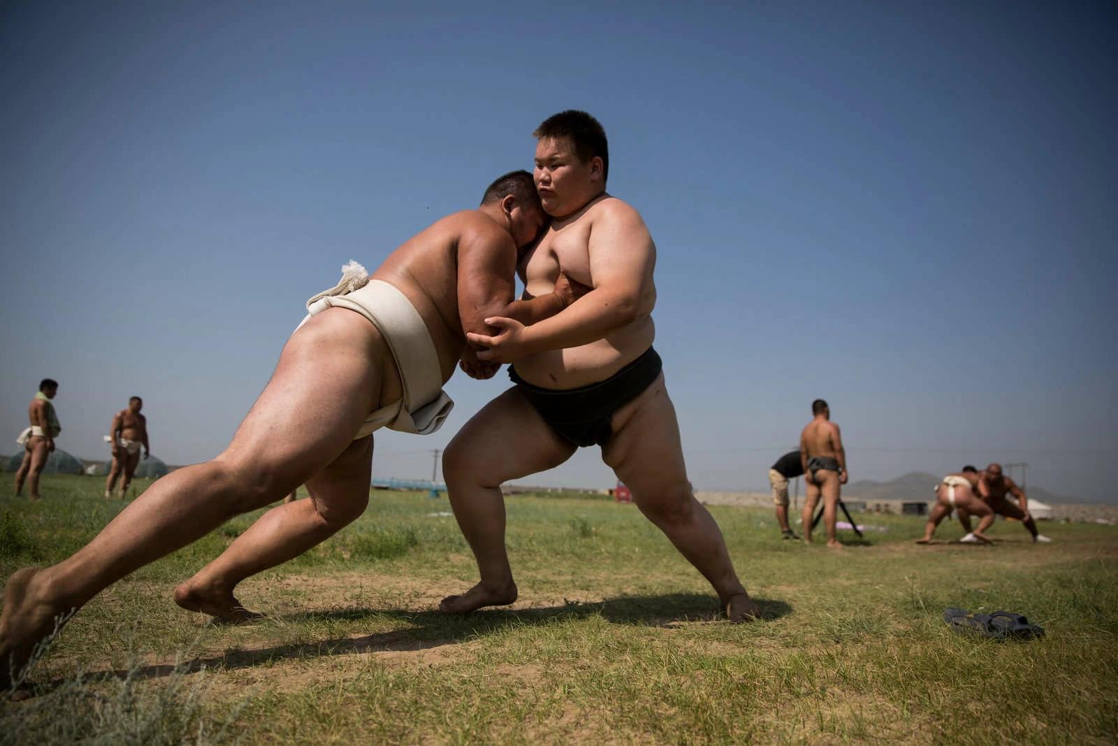 Wrestlers practice their tachi-ai (initial charge) at a sumo wrestling training camp on the outskirts of Ulaanbaatar, Mongolia on Tuesday, July 26, 2016. Photo and story credits by Taylor Weidman.